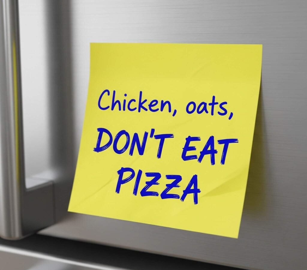 Messy meal plan sticky note on fridge