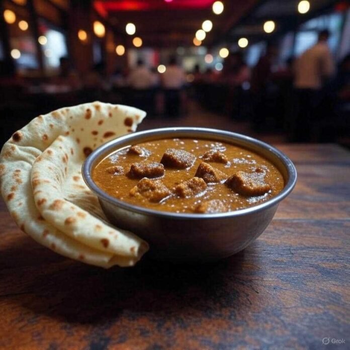 Steaming dal makhani with dumbbell paneer, half-torn roti. Steaming dal makhani with dumbbell paneer, half-torn roti.